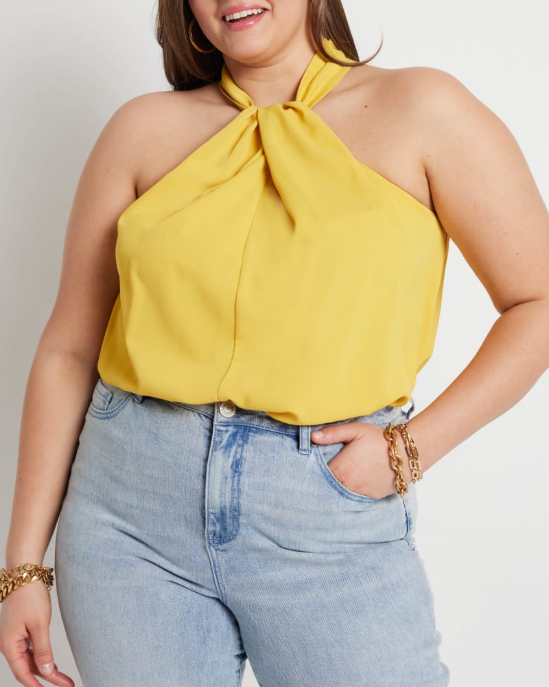 Front of a model wearing a size 14 Zoe Halter Neck Top in Sunshine by ELOQUII. | dia_product_style_image_id:215385